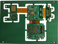 Rigid-flex PCB with rigid sections joined by flexible interconnects.